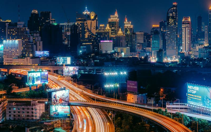 Bangkok expressway curving through the city at night